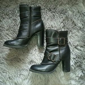 Buckle round-toed boots.